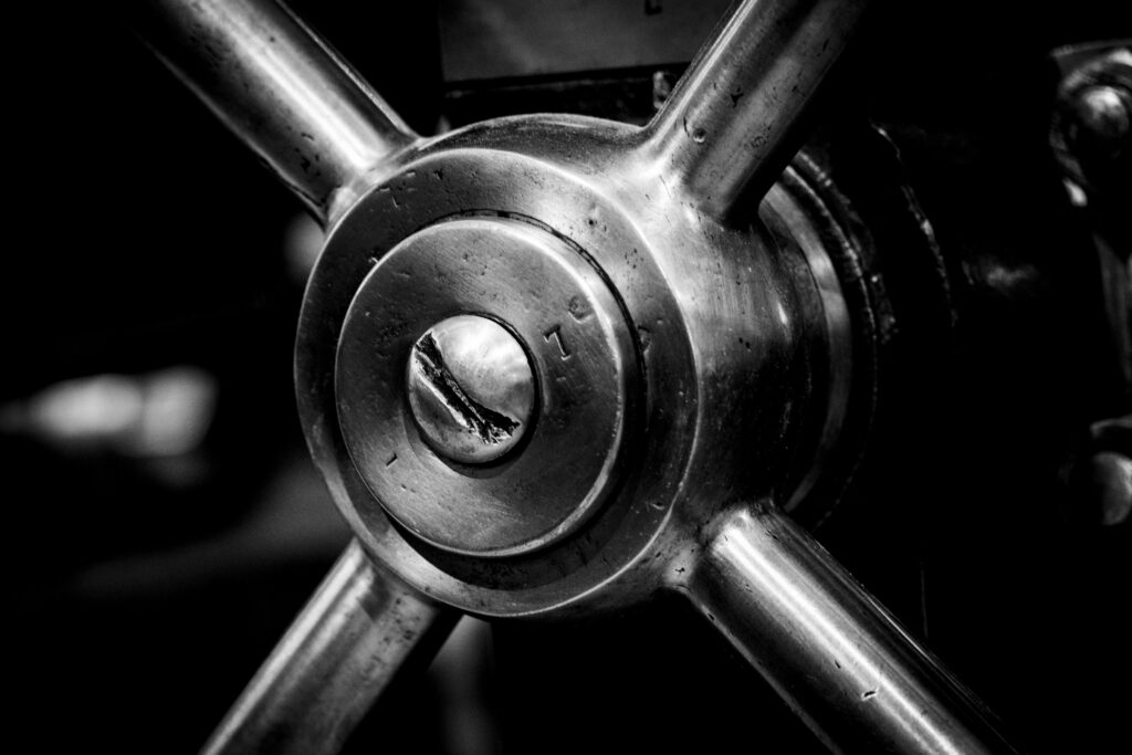 Close up of industrial metal cog in black and white