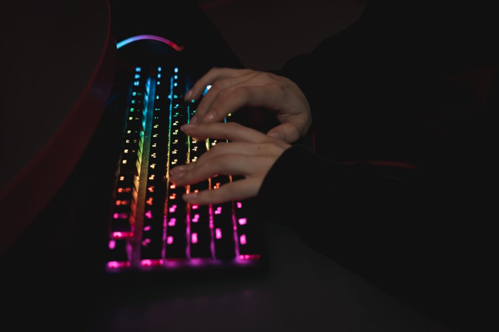 Close up view of a person typing on keyboards